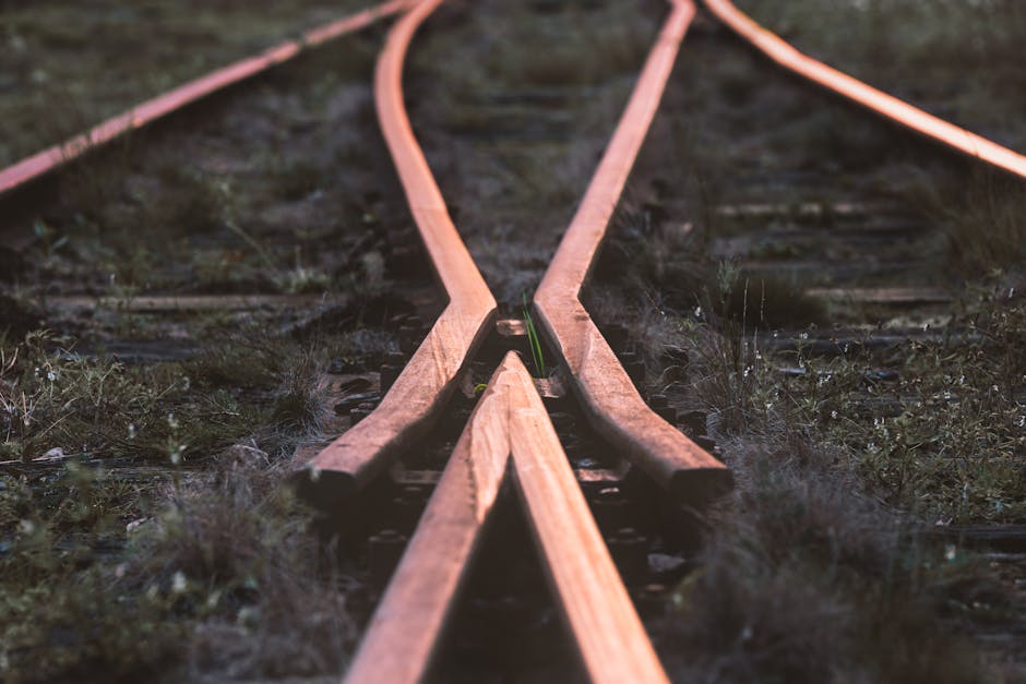 Close-up of rustic railway tracks intersecting in Norra Skara, Sweden.